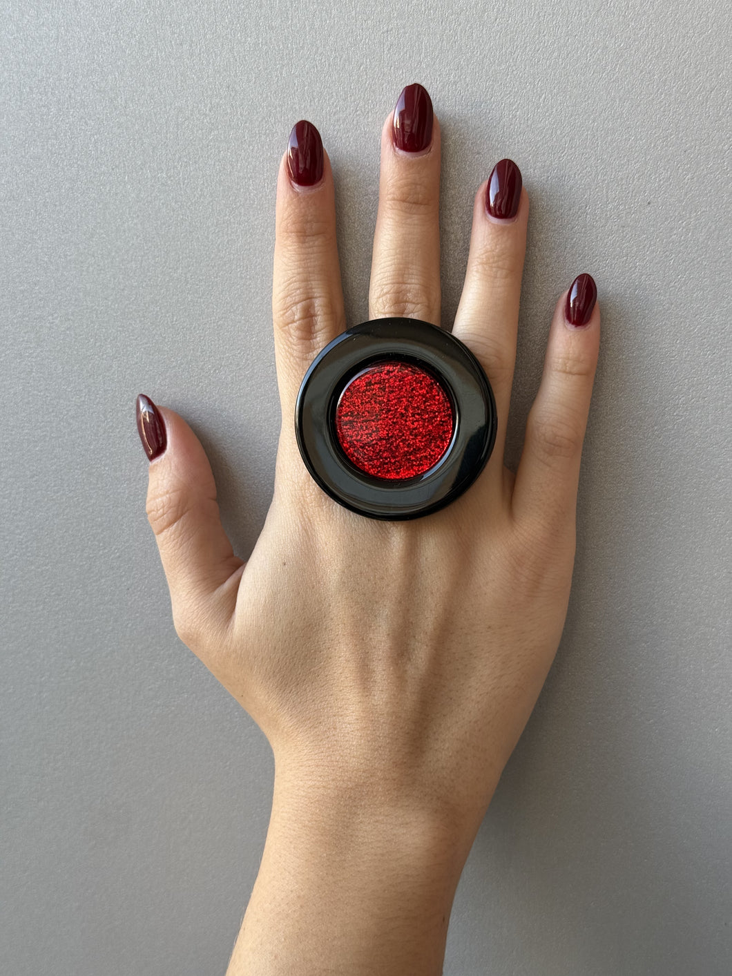 Anello Saturn rosso glitter e nero