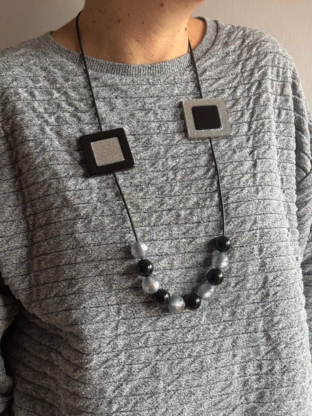 Collana smile inverter nero e argento